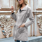 Women’s Relaxed Fit Waterproof Long Rain Jacket – Adjustable Hood, Comfortable Outdoor Coat for All-Weather Protection 0